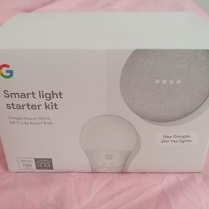 Light grey google home mini with smart light